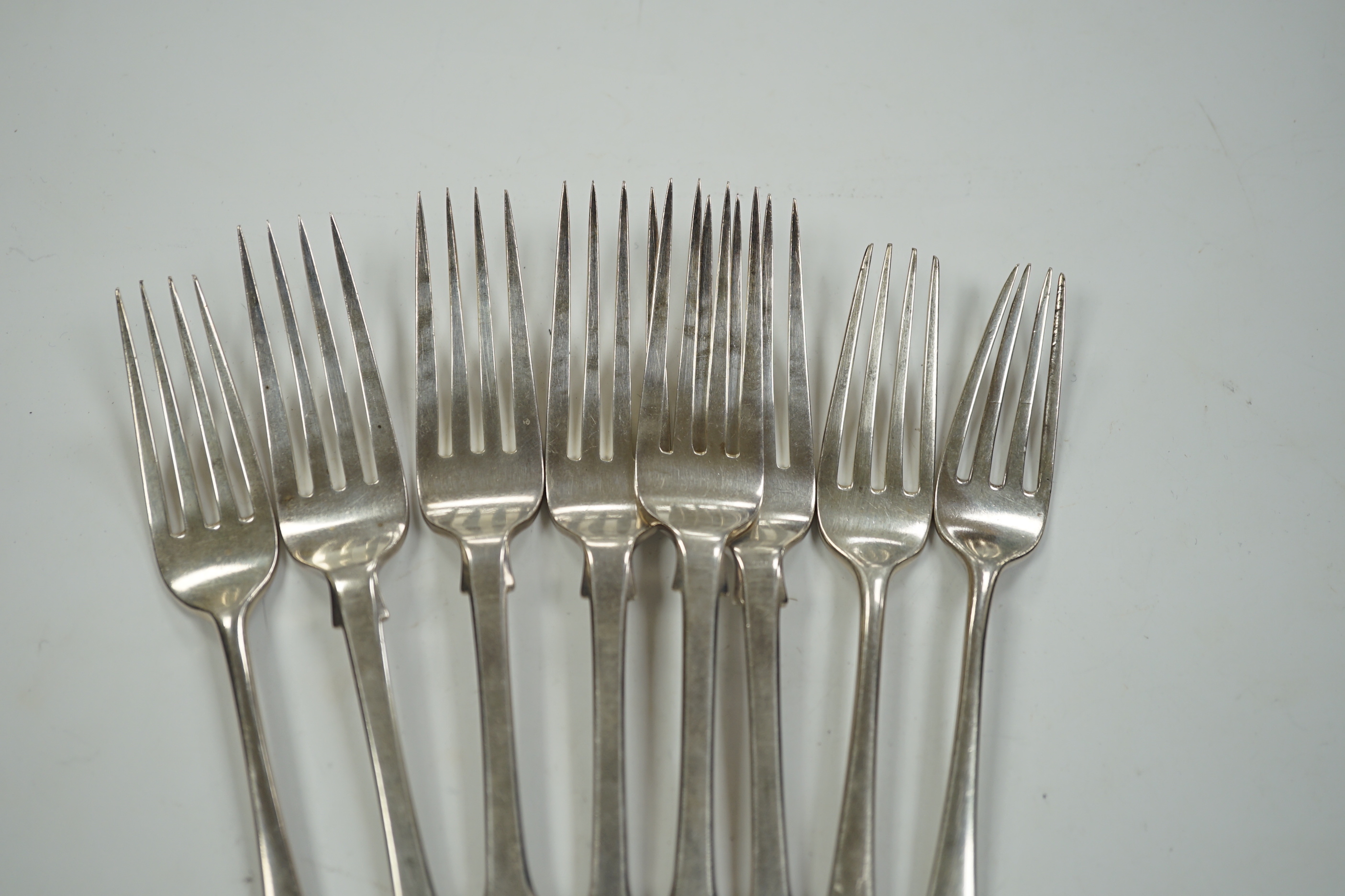 Five Victorian silver fiddle pattern dessert forks, London, 1854 and three George III silver dessert forks, 10.9oz.